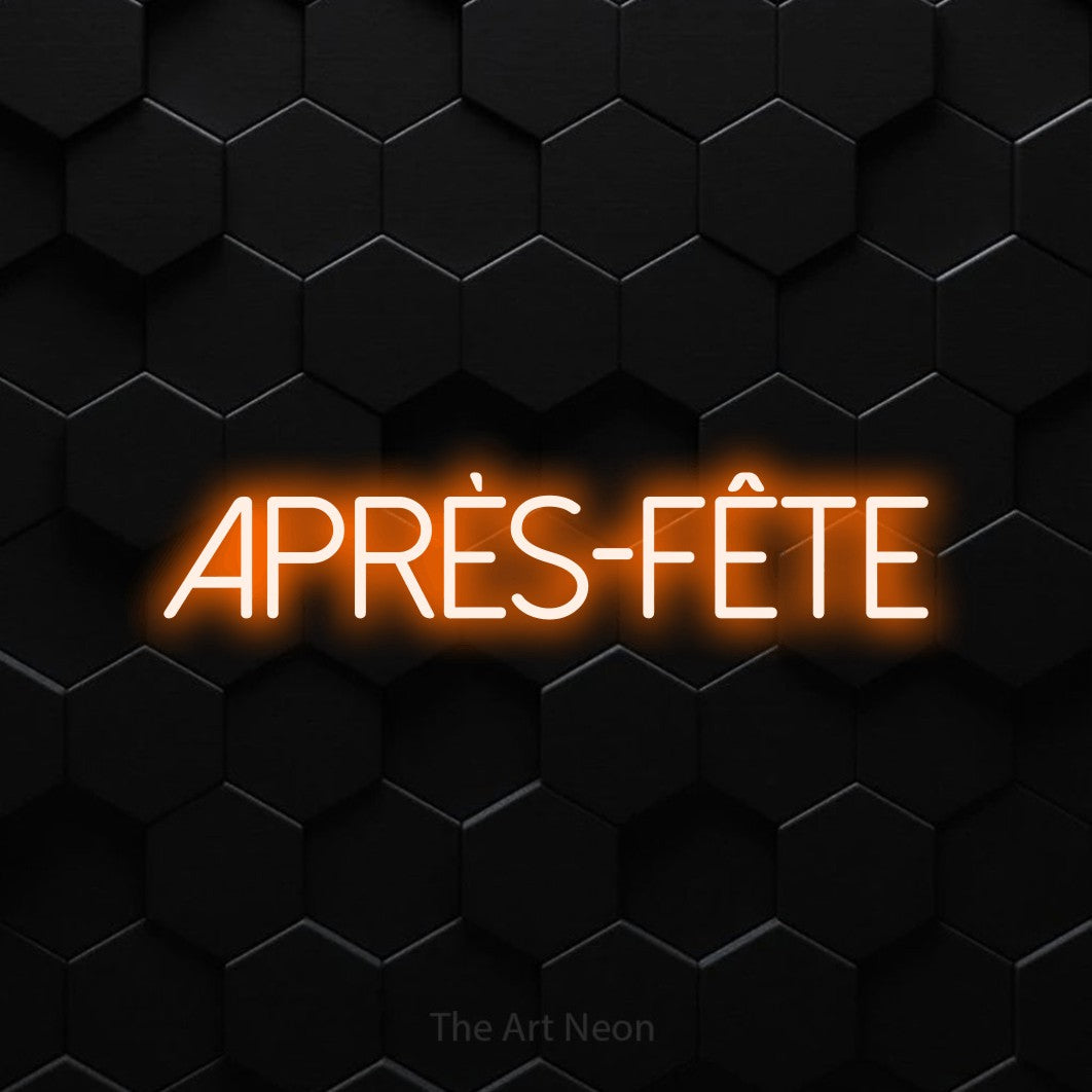“Après-fête” LED neon sign in orange, with thin sans-serif lettering, shown against black hexagonal wall tiles.