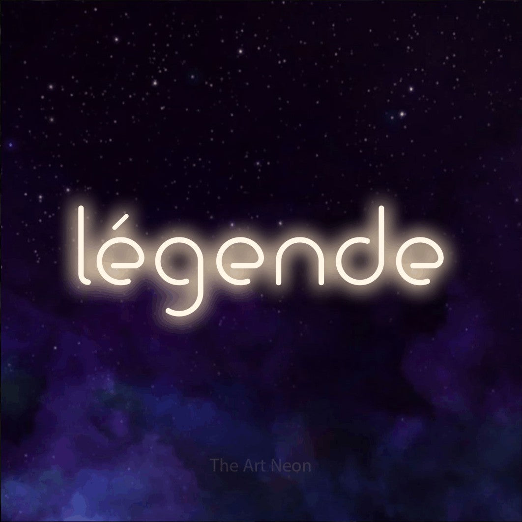 “Légende” LED neon sign in warm white, with stylised geometric lettering, shown against a purple galaxy backdrop.