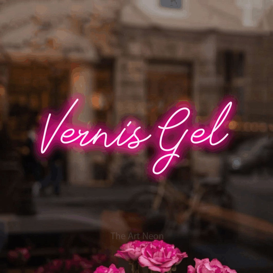 “Vernis gel” LED neon sign in hot pink, with cursive lettering, shown against a blurred café-bar interior.