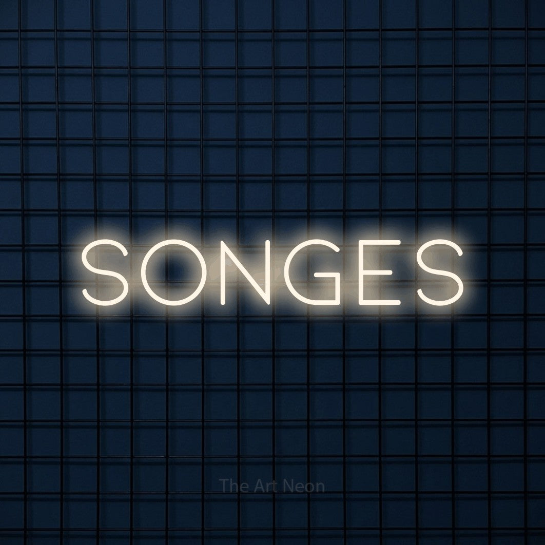“Songes” LED neon sign in warm white, with thin, widely spaced lettering, shown against a dark blue grid.