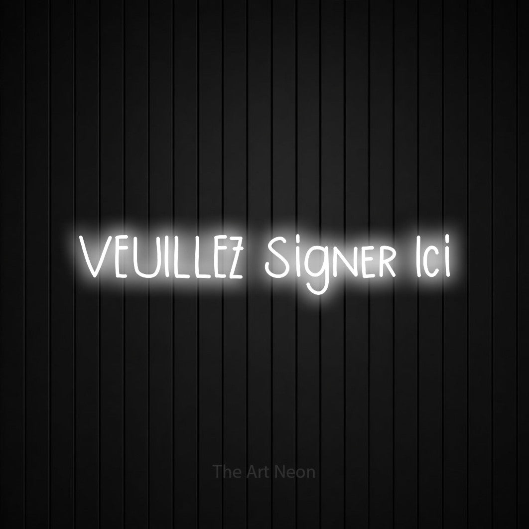“Veuillez signer ici” LED neon sign in cool white, with narrow hand-drawn lettering, shown against black vertical wall slats.